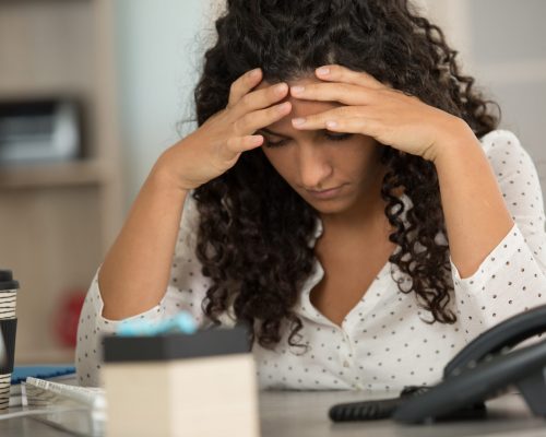 young woman stressed at work